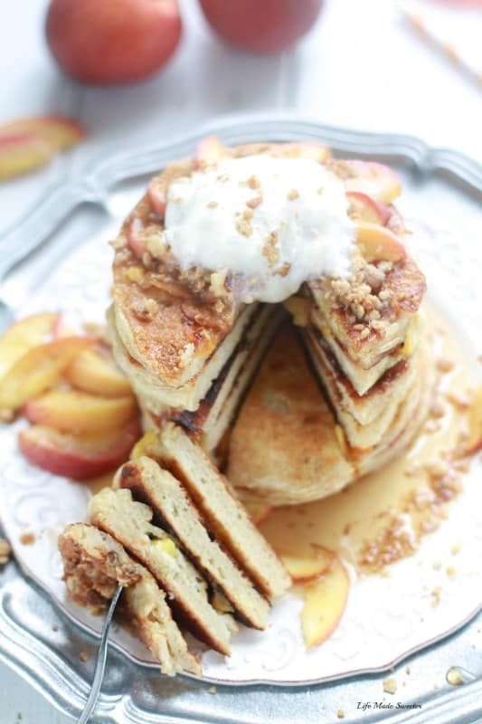 Peach Cobbler Pancakes - fluffy pancakes filled with juicy peaches topped with a warm spiced streusel is like having a yummy peach cobbler for breakfast