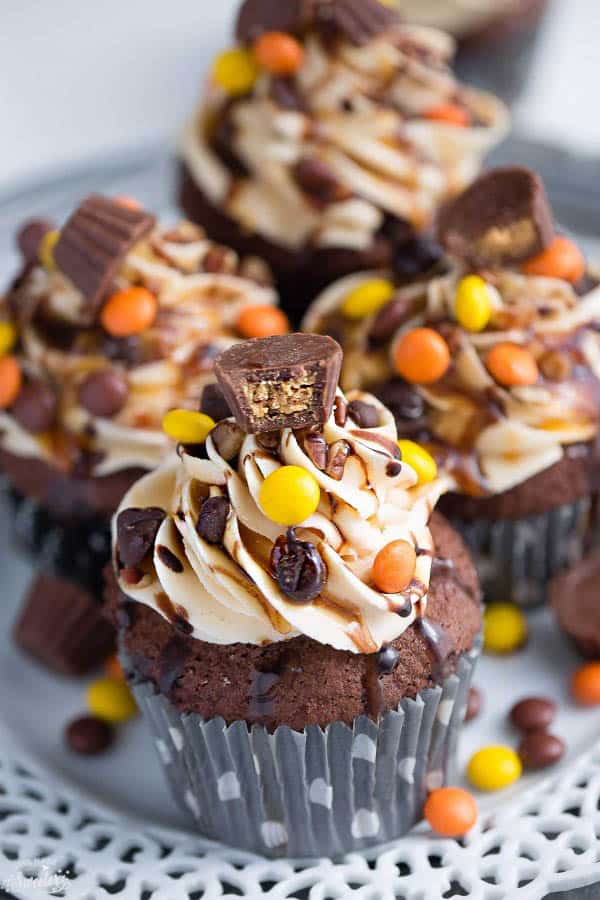 Four Reese's Peanut Butter Cup Chocolate Cupcakes on a plate