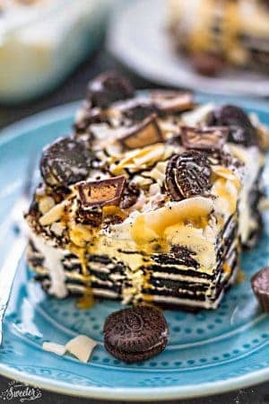 Peanut Butter Oreo Icebox Cake - the perfect easy and cool dessert for summer potlucks, barbecues, picnics, parties and cookouts. Best of all, only a few ingredients with layers of Oreo cookies, Reese's peanut butter cups and sweet rich caramel sauce. So delicious and always a crowd-pleaser!