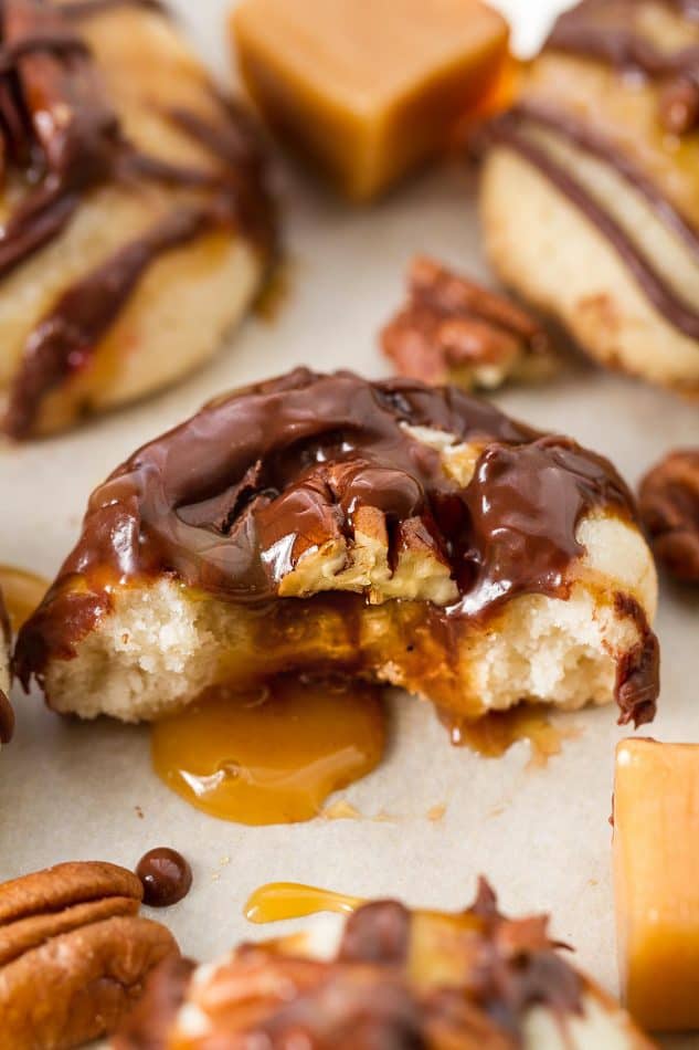 Pecan Turtle Shortbread Thumbprint Cookies make the perfect holiday treat for your Christmas cookie platter. Best of all, they're so easy to make and are full of creamy caramel, chocolate and a crunchy pecan center.