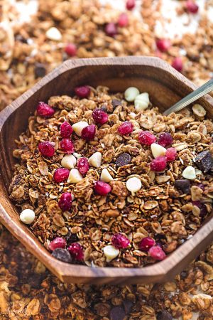 Pomegrante White Chocolate Granola makes the perfect holiday snack or breakfaast! Best of all, it's so easy to make and full of big crunchy clusters!