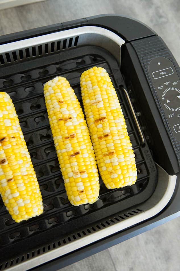 Close-up view of ears of corn in a Power Smokeless grill