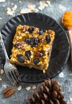 Pumpkin Baked Oatmeal with Chocolate and Pecans - the perfect easy make-ahead breakfast or brunch for fall! Best of all, you can bake them into muffin tins for grab and go oatmeal cups or take them along to work or school. They're full of cozy warm flavors and come together easily in just one bowl using healthy and wholesome ingredients. Gluten free & refined sugar free.