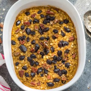 Top view of Pumpkin Baked Oatmeal in a white casserole dish