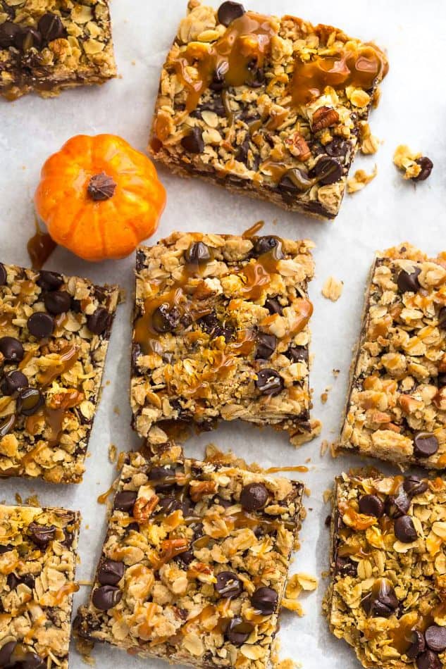 Pumpkin Carmelitas are the easy treat for fall. Best of all, they're soft, chewy and full of delicious layers of oatmeal, pumpkin, pumpkin spice, chocolate and gooey caramel. Great for bringing along to dessert bars or any potluck or parties.