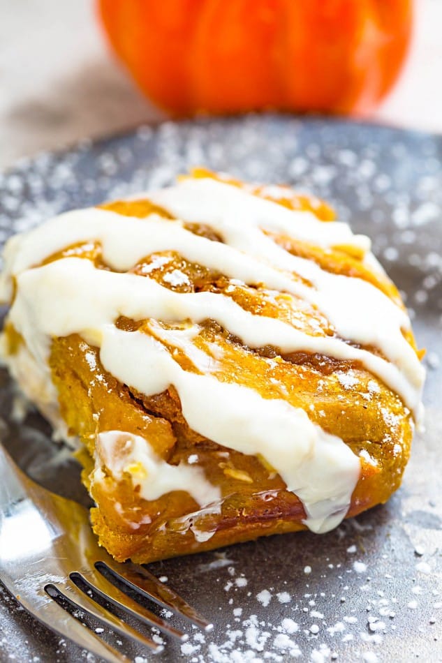 Pumpkin Cinnamon Rolls make the perfect indulgent breakfast or brunch. They're soft, fluffy and made completely from scratch. The best part is, how easy you will fall in love after one bite and even better how amazing your house will smell while these delicious rolls bake in your oven!