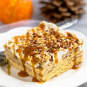 No Bake Pumpkin Icebox Cake makes the perfect make ahead fall dessert. Best of all, takes just minutes to whip up and full of cozy fall flavors! Made with layers of graham crackers and pumpkin cream cheese mousse. A delicious dessert for holiday parties and get togethers and much easier to bring than a pumpkin pie.