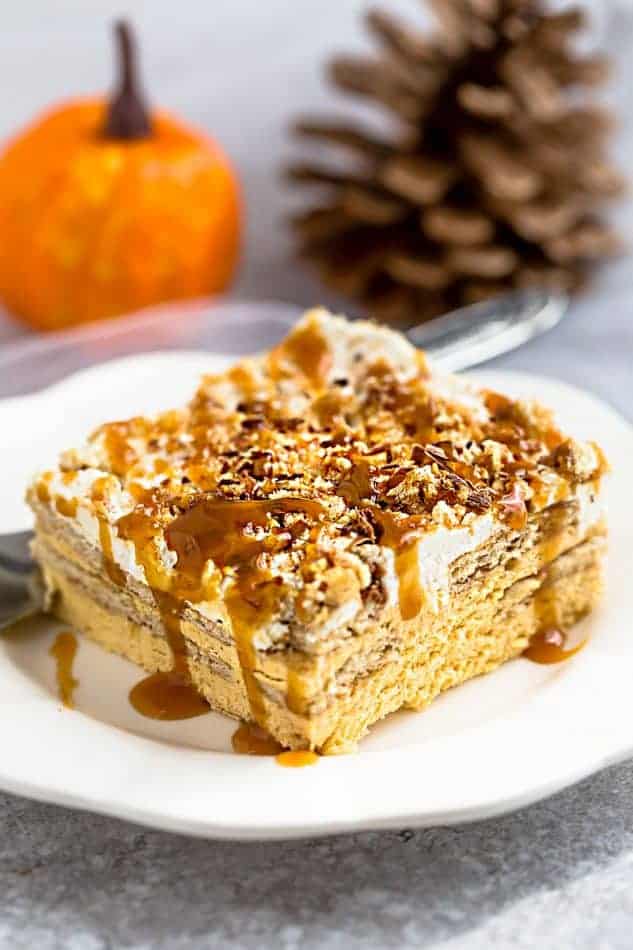 No Bake Pumpkin Icebox Cake makes the perfect make ahead fall dessert. Best of all, takes just minutes to whip up and full of cozy fall flavors! Made with layers of graham crackers and pumpkin cream cheese mousse. A delicous dessert for holiday parties and get togethers and much easier to bring than a pumpkin pie.