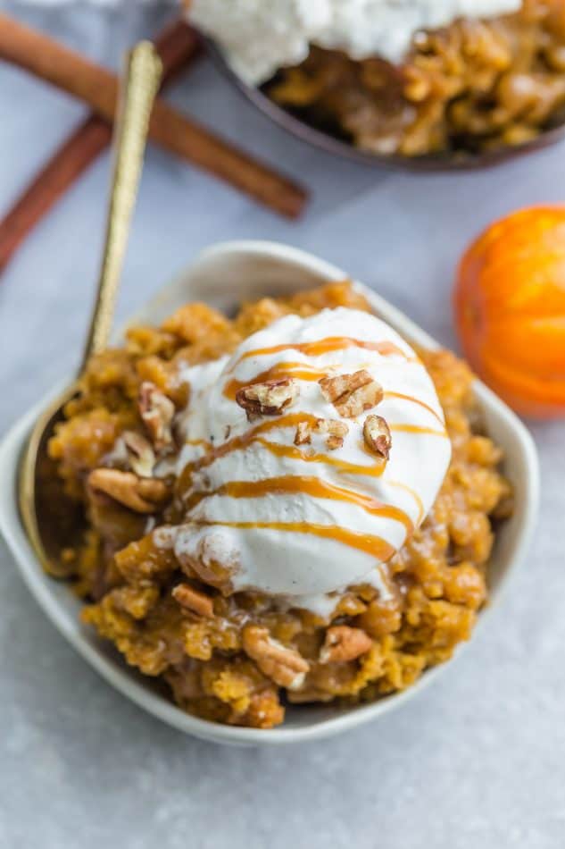 Pumpkin Pudding Cake - the perfect easy dessert for fall. Best of all, comes together easily in just one bowl with less than 15 minutes of prep time. Full of cozy warm pumpkin pie spices, cinnamon and gooey pumpkin. It's like a crossover between a lava cake and pumpkin pie - so soft, moist and delicious! Perfect for Thanksgiving and fall gatherings, parties or get togethers.