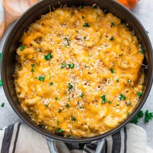 This recipe for Easy Pumpkin Stovetop Macaroni & Cheese takes only 30 minutes to make for a perfect weeknight meal for fall. Best of all, it's super creamy and made with a mix of three popular cheeses: sharp cheddar, parmesan and cream cheese. It's the ultimate fall comfort food and makes the perfect side dish for Thanksgiving or the Christmas holiday feast! #lunch #dinner #comfortfood #pumpkin #macandcheese #macaroniandcheese