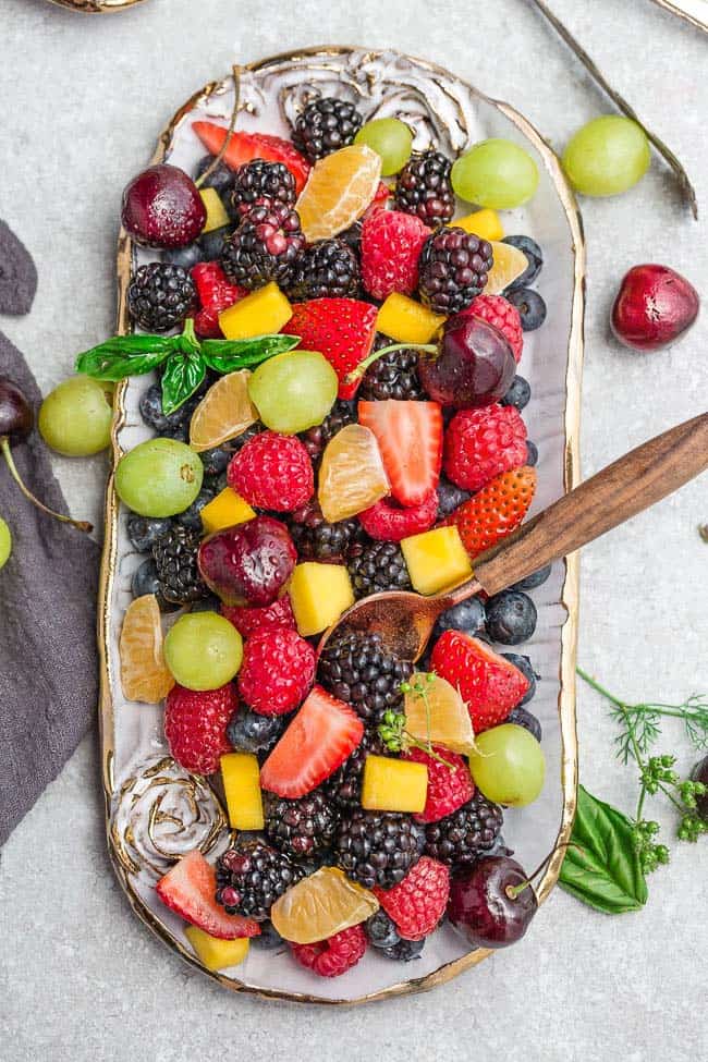 Easy Fruit Salad Made With Fresh Fruit And Sweet Honey Lime Dressing