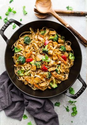 Asian Sesame Chicken Noodles - a one pot 30 minute meal perfect to curb those takeout cravings. Made with chicken, veggies, gluten free rice noodles and a delicious savory Asian-inspired sauce.