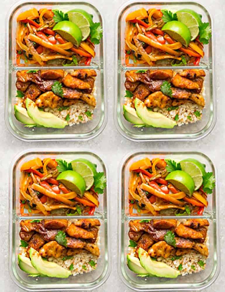 Top view of four meal prep containers of chicken fajitas filling