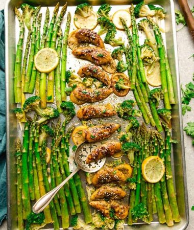 Sheet Pan Honey Lemon Chicken - the perfect easy meal for busy weeknights. Best of all, made with tender and juicy chicken, asparagus coated in a sweet and savory sauce.