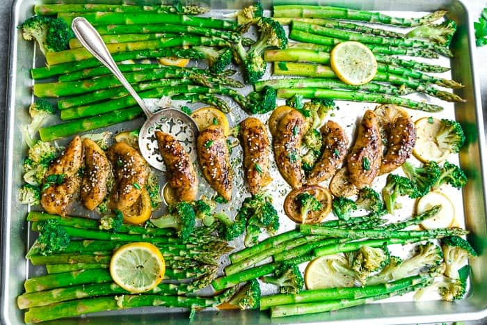 Sheet Pan Honey Lemon Chicken - the perfect easy meal for busy weeknights. Best of all, made with tender and juicy chicken, asparagus coated in a sweet and savory sauce. 