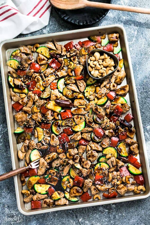 Sheet Pan Kung Pao Chicken has all the flavors of the popular Chinese restaurant takeout dish made on a sheet pan. Best of all, super easy to make with paleo friendly options. Plus a serving of tender crisp broccoli and red & green bell peppers for a healthier meal. Perfect for busy weeknights! Plus a step-by-step how to video! Weekly Sunday meal prep for the week and leftovers are great for lunch bowls & lunchboxes for work or school.
