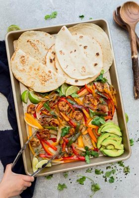 healthy sheet pan shrimp fajitas dinner with low carb tortillas
