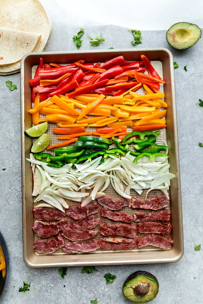Sheet Pan Steak Fajitas are tender, juicy and full of flavor and perfect for busy weeknights! Best of all, options for low carb and keto with a homemade fajita spice blend and cilantro lime marinade.