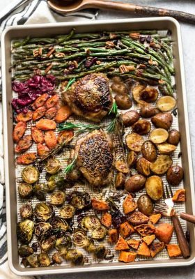 Sheet Pan Turkey Dinner For Two - an easy and healthy one pan Thanksgiving meal for two (or four). Best of all, everything cooks up in under an hour. Includes a juicy turkey, potatoes, green beans, carrots, sweet potatoes and cranberries.