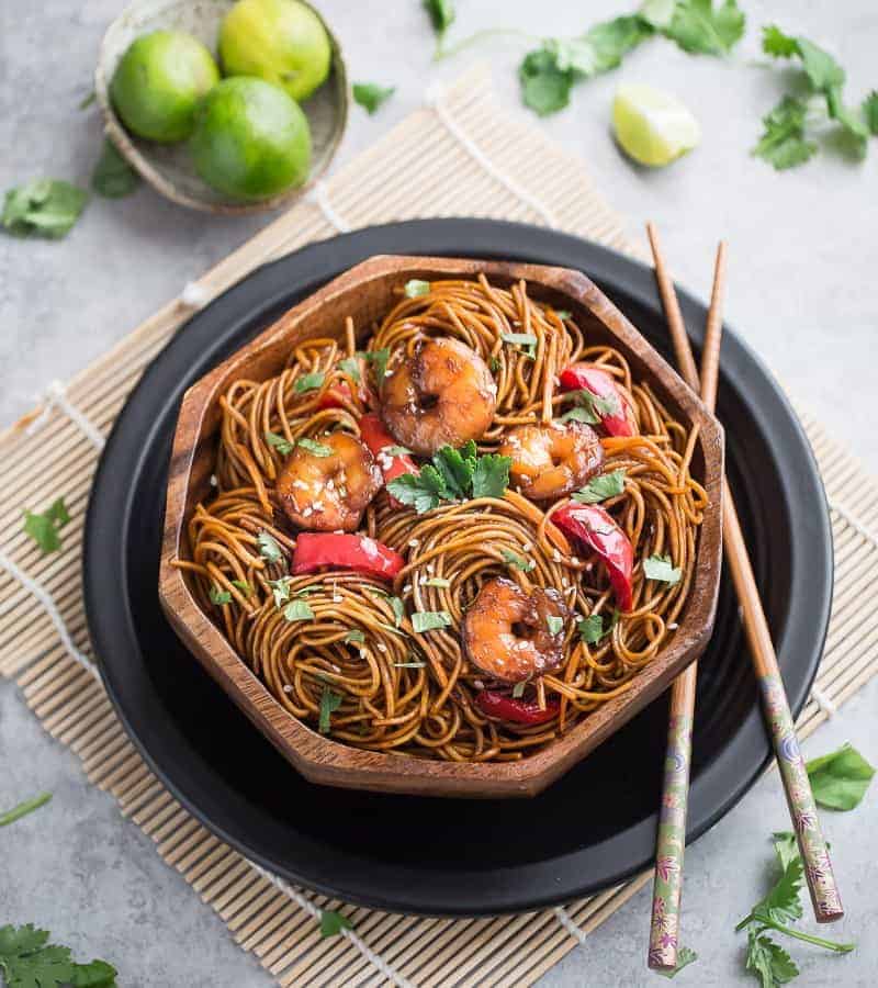 Top view of Shrimp Lo Mein in a bowl with chopsticks