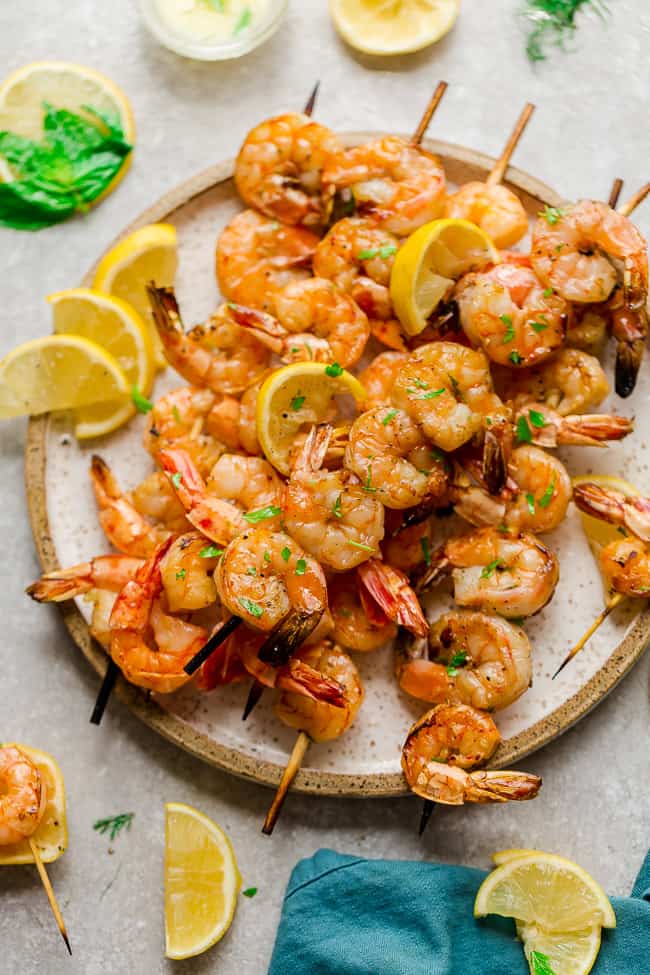 Grilled Shrimp Skewers with Lemon Herb Butter Sauce - seasoned with a fresh and flavorful citrus herb combo for the perfect light and tasty low carb dish for summer parties, lunches and dinners. Best of all, just a few ingredients and only 20 minutes to make. 