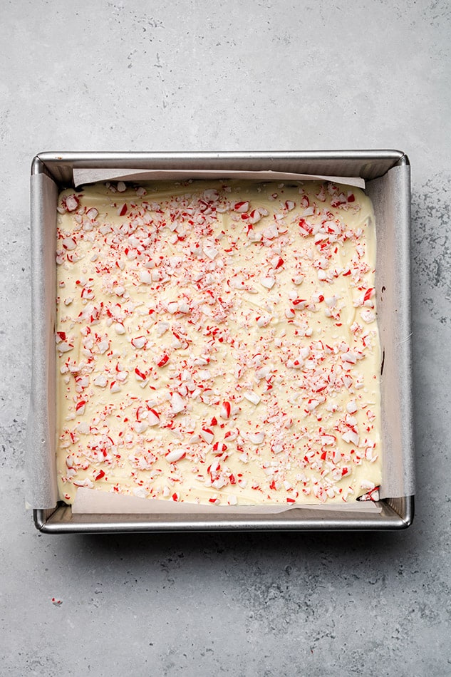 Overhead view of homemade peppermint bark in a square pan