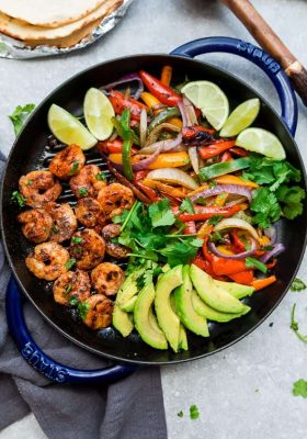 Skillet Shrimp Fajitas - the perfect easy and healthy one pan meal for busy weeknights. Best of all, bursting with chili lime flavors & served with low carb tortillas. Ready in just 20 minutes and easy to customize with chicken or steak.