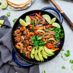 Skillet Shrimp Fajitas - the perfect easy and healthy one pan meal for busy weeknights. Best of all, bursting with chili lime flavors & served with low carb tortillas. Ready in just 20 minutes and easy to customize with chicken or steak.