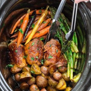 Slow Cooker Harvest Chicken and Autumn Vegetables is an easy set and forget meal that's perfect for busy weeknights and an alternative to Thanksgiving dinner. Best of all, this meal in one is easy to customize and made with tender and juicy chicken, flavorful herbs and hearty fall vegetables. So easy to make with less than 15 minutes of prep time.