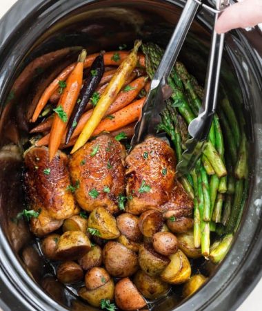 Slow Cooker Harvest Chicken and Autumn Vegetables is an easy set and forget meal that's perfect for busy weeknights and an alternative to Thanksgiving dinner. Best of all, this meal in one is easy to customize and made with tender and juicy chicken, flavorful herbs and hearty fall vegetables. So easy to make with less than 15 minutes of prep time.