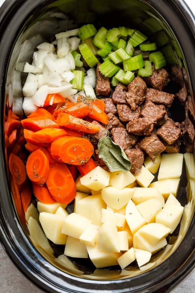 stew beef, carrots, potatoes, celery and onion in a slow cooker for beef stew