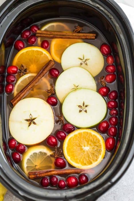 Top view of crockpot apple cider in a slow cooker