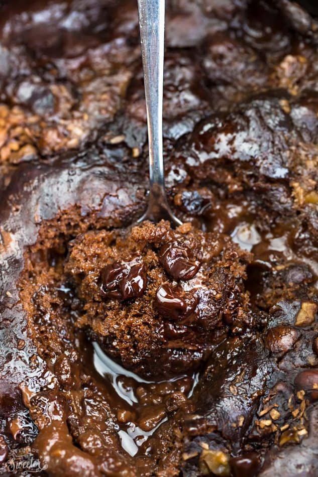 Slow Cooker Hot Fudge Pudding Cake an easy crock-pot dessert perfect for freeing up your oven. With a delicious sauce that forms beneath the cake and best part of all is how easy it is to customize with 4 fun toppings like an ice cream sundae! Plus a step-by-step video!