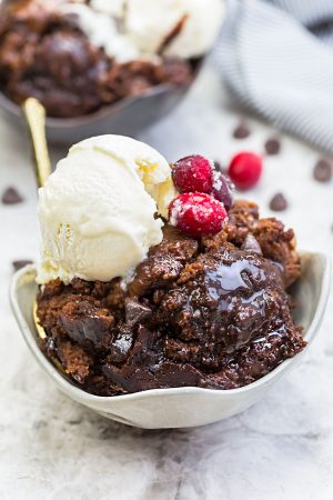Slow Cooker Hot Fudge Pudding Cake an easy crock-pot dessert perfect for freeing up your oven. With a delicious sauce that forms beneath the cake and best part of all is how easy it is to customize with 4 fun toppings like an ice cream sundae! Plus a step-by-step video!