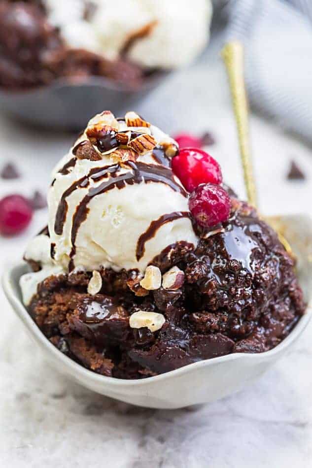 Slow Cooker Hot Fudge Pudding Cake an easy crock-pot dessert perfect for freeing up your oven. With a delicious sauce that forms beneath the cake and best part of all is how easy it is to customize with 4 fun toppings like an ice cream sundae! Plus a step-by-step video!