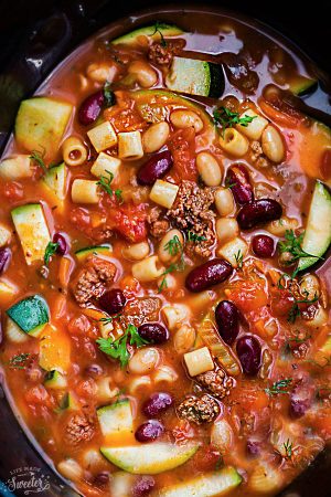 Slow Cooker Pasta e Faglioli is a lightened up and hearty stick-to-your-ribs soup perfect for a chilly day. Best of all, this copycat recipe for Olive Garden’s Pasta e Fagioli is healthy with options to make this gluten free. Comes together easily in your crock-pot and can be made ahead of time for an easy set and forget it meal!