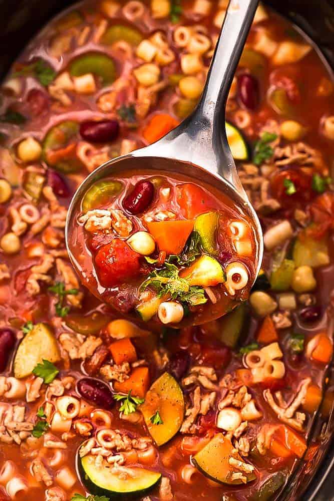 Slow Cooker Pasta e Faglioli is a lightened up and hearty stick-to-your-ribs soup perfect for a chilly day. Best of all, this copycat recipe for Olive Garden’s Pasta e Fagioli is healthy with options to make this gluten free. Comes together easily in your crock-pot and can be made ahead of time for an easy set and forget it meal!
