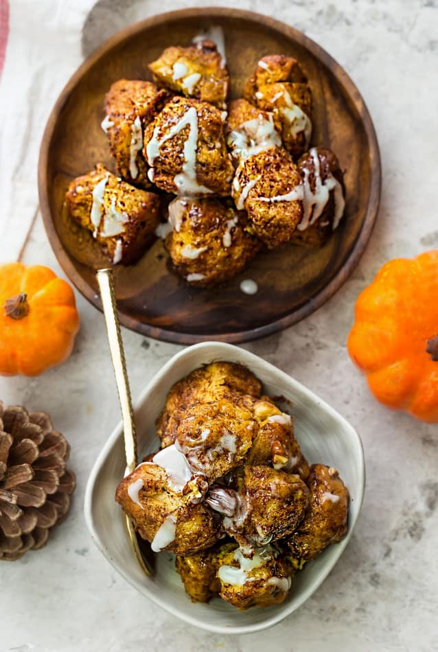 Slow Cooker Pumpkin Monkey Bread makes the perfect easy breakfast or brunch. Best of all, it's so easy to make with refrigerated cinnamon roll dough and it's full of cozy fall spices and a pumpkin cheesecake filling. So delicious for the holidays or any regular day.