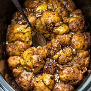 Slow Cooker Pumpkin Monkey Bread makes the perfect easy breakfast or brunch. Best of all, it's so easy to make with refrigerated cinnamon roll dough and it's full of cozy fall spices and a pumpkin cheesecake filling. So delicious for the holidays or any regular day.