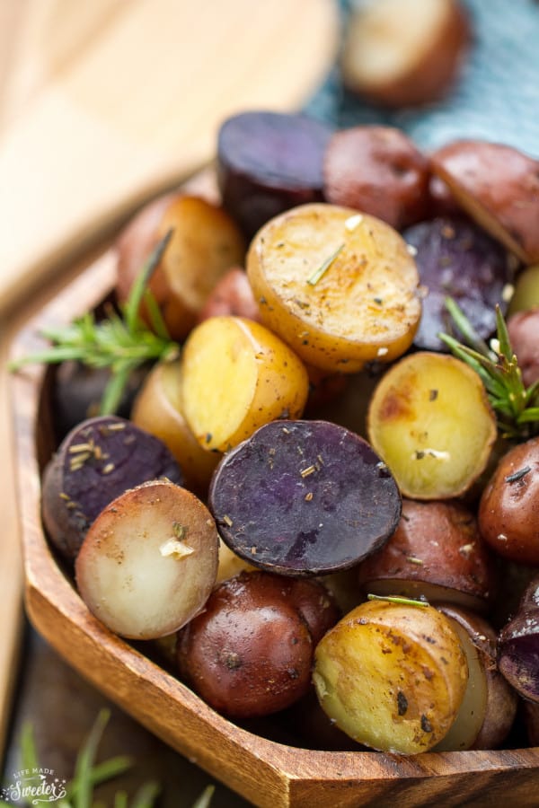  Tender and crisp tri-color potatoes loaded with rosemary, thyme, oregano, garlic and a sprinkle of parmesan. An easy an simple side dish made in the slow cooker.