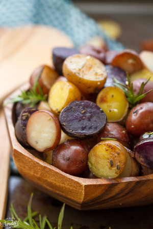 Tender and crisp tri-color potatoes loaded with rosemary, thyme, oregano, garlic and a sprinkle of parmesan. An easy an simple side dish made in the slow cooker.