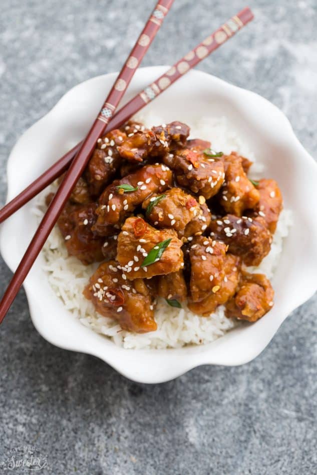 Slow Cooker Sriracha Chili Chicken recipe is the perfect easy weeknight dinner. Best of all, there is only 10 minutes of prep and is so much better than take-out. Simmered in a flavorful and spicy Sriracha chili sauce, this is sure to become a family favorite. Great for Sunday meal prep and leftovers are perfect for school or lunch bowls 