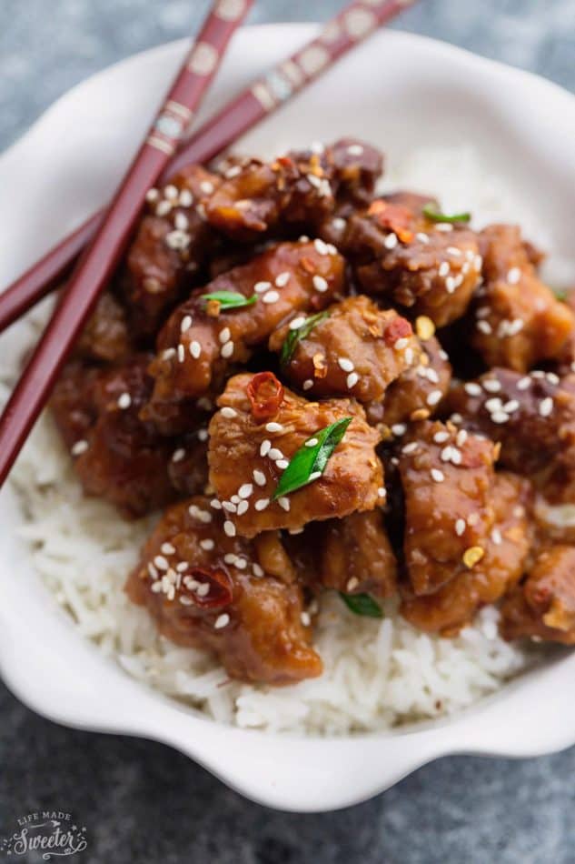 Slow Cooker Sriracha Chili Chicken recipe is the perfect easy weeknight dinner. Best of all, there is only 10 minutes of prep and is so much better than take-out. Simmered in a flavorful and spicy Sriracha chili sauce, this is sure to become a family favorite. Great for Sunday meal prep and leftovers are perfect for school or lunch bowls 