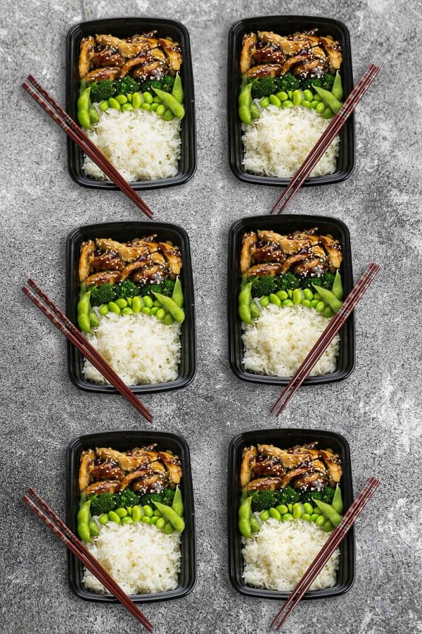 Six Chicken Teriyaki Bowls with dark brown chopsticks.