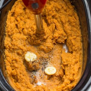 Top view of cooked mashed sweet potatoes in a slow cooker