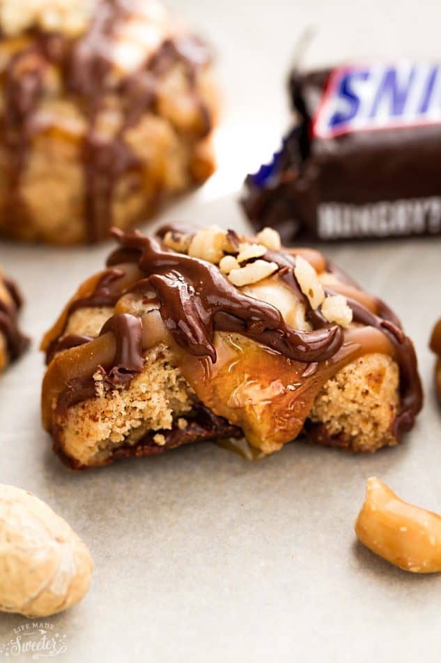 Close-up of a Snickers Thumbprint Cookie with a bite out of it
