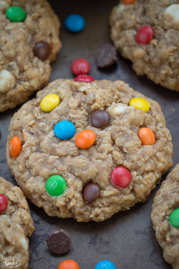 Close-up of Soft & Chewy Oatmeal Monster M&M Cookies on a baking sheet