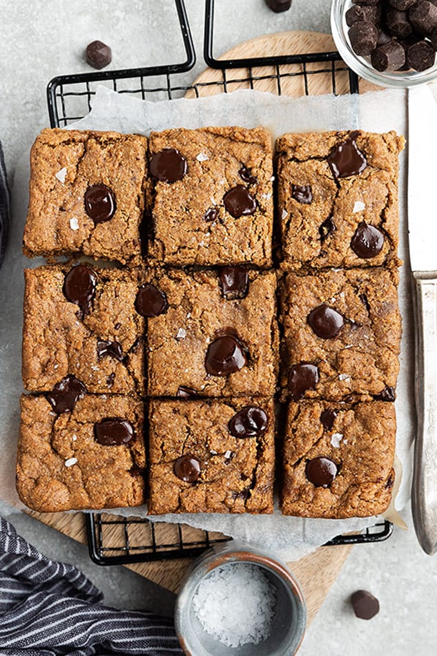 Overhead view of chocolate chip cookie bars garnished with flaked sea salt.