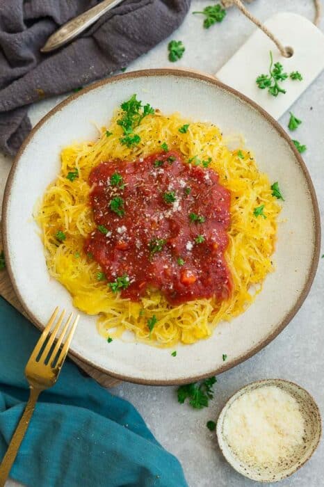Spaghetti squash in a bowl topped with tomato sauce