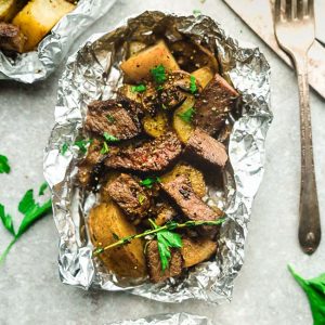 Steak and Potatoes Foil Packets are full of flavor with mushrooms, garlic, butter, herbs and perfect for busy weeknights. Best of all, instructions to make these in the oven and the grill.